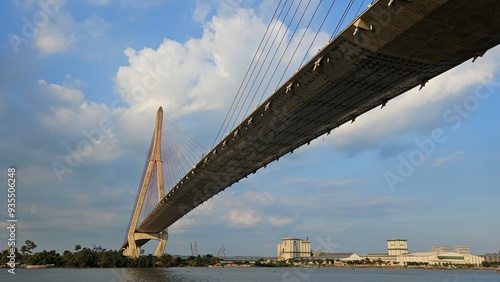 Bottom view of Can Tho cable-stayed bridge beetween Vinh Long city and Can Tho city, Mekong Delta Vietnam in sunset. 
Perspective from Hau river. photo