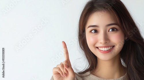 Wallpaper Mural Asian Smiling woman pointing finger to the side isolated on white background with copy space : Generative AI Torontodigital.ca
