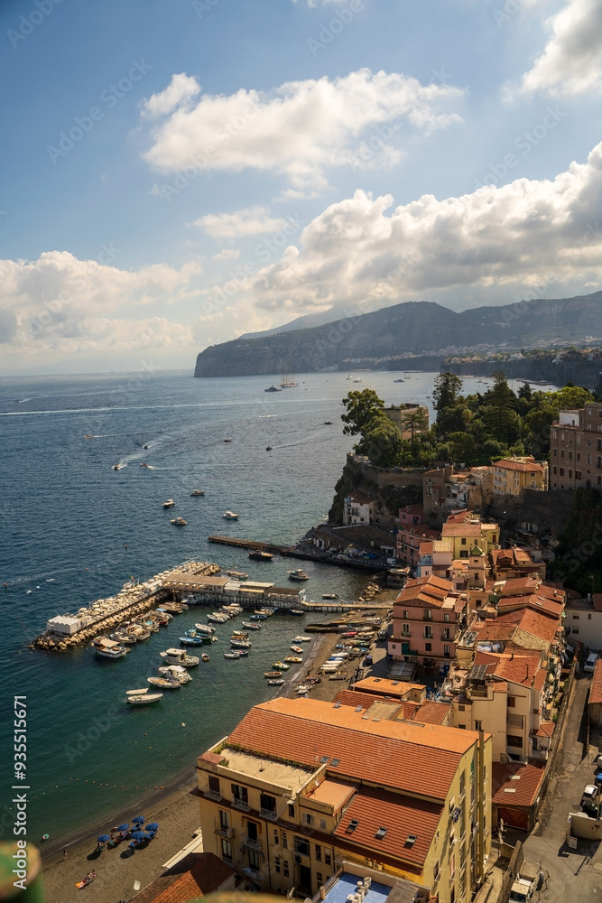Scenic Coastal View of Quaint Seaside Village and Harbor, Sorrento in Italy Europe against dramatic clouds