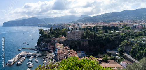 Obraz na płótnie Panoramic drone shot of Sorrento town in Italy against dramatic clouds, cityscape of Italian town port harbor in south w salonie