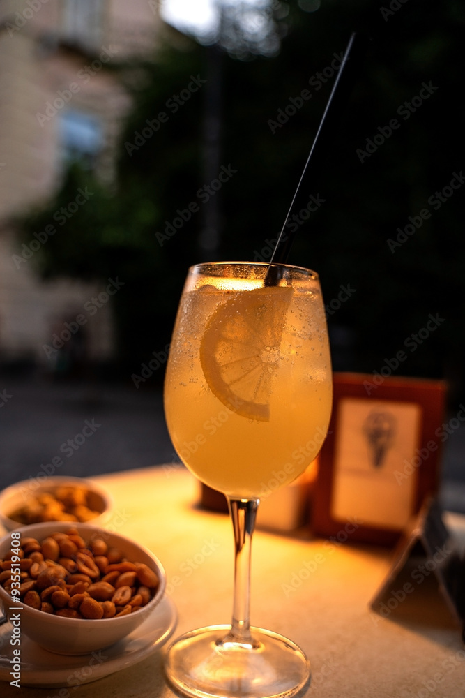 Limoncello spritz drink of liqueur, sparkling wine and lemon in cocktail glass