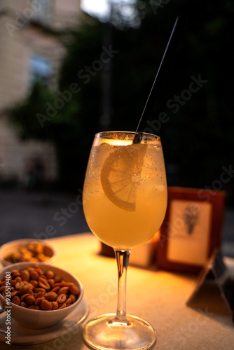 Obraz na płótnie Limoncello spritz drink of liqueur, sparkling wine and lemon in cocktail glass w salonie