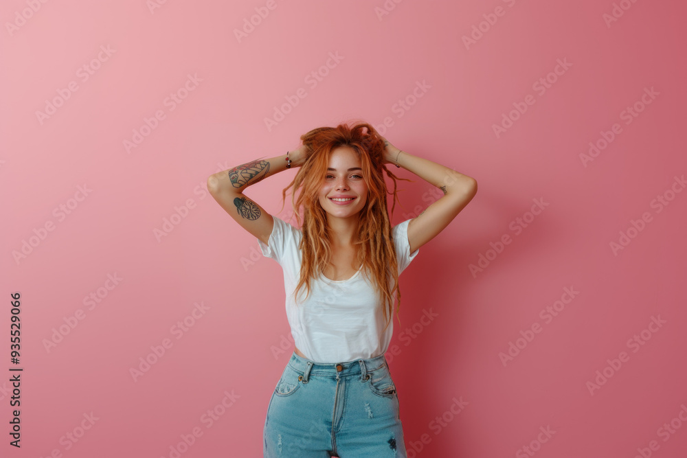 Smiling woman with dreadlocks posing against pink background Smiling woman with dreadlocks posing against pink background