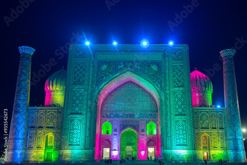 Light show on the facades of the madrasahs of Registan Square. photo