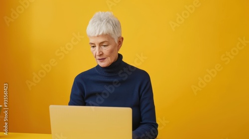 The elderly woman using laptop photo