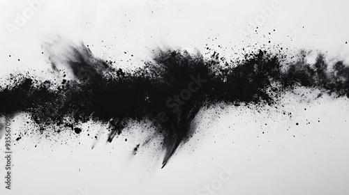 Abstract explosion of dark charcoal dust on white background