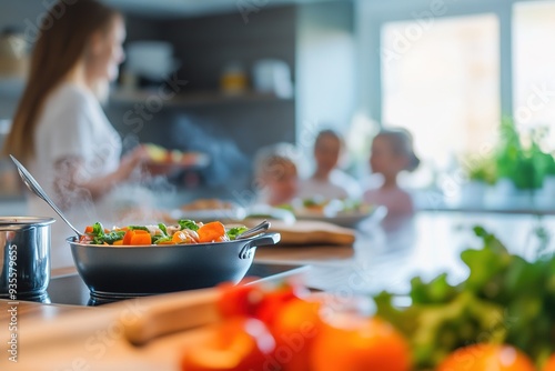 Pan of fresh vegetables on stove, mother cooking for family in b photo