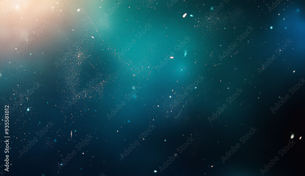 Fototapeta premium Abstract blue background with white speckles and blurred light.