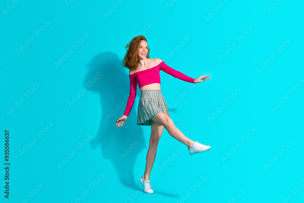 Full size photo of pretty young girl dancing wear top isolated on teal color background Full size photo of pretty young girl dancing wear top isolated on teal color background