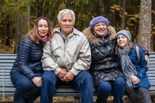 Portrait of a large family of different generations in autumn park