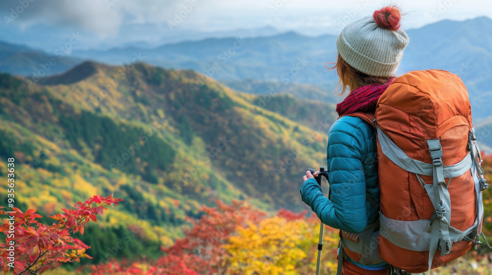 A woman with a backpack standing on top of mountains, AI