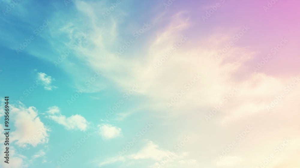 Fototapeta premium A serene sky scene with pastel colors blending seamlessly, featuring delicate clouds against a cyan to pink gradient.