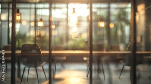 Bright sunlit interior of a modern office space with glass walls at sunrise