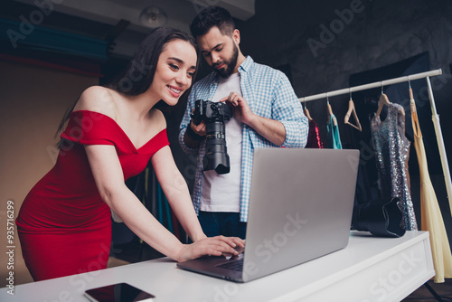 Photo of positive cameraman passionate seductive woman showing modern device video indoors workplace studio photo