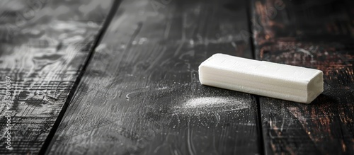 a chalkboard eraser and chalk on a desk. Copy space image. Place for adding text and design photo