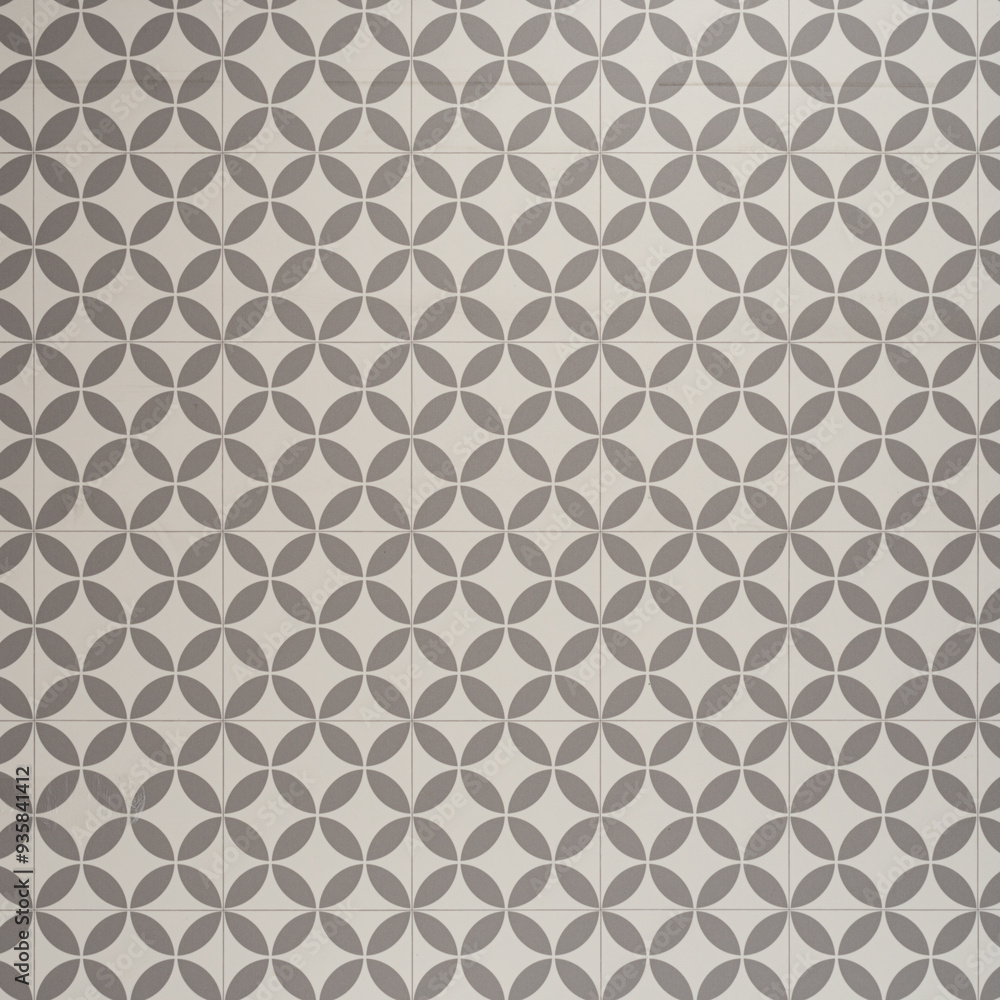 Fototapeta premium Geometric Patterned Tile Design with Gray and White Circular Motifs