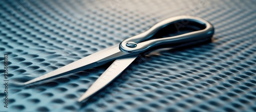 Close-up of Polished Scissors on Textured Surface