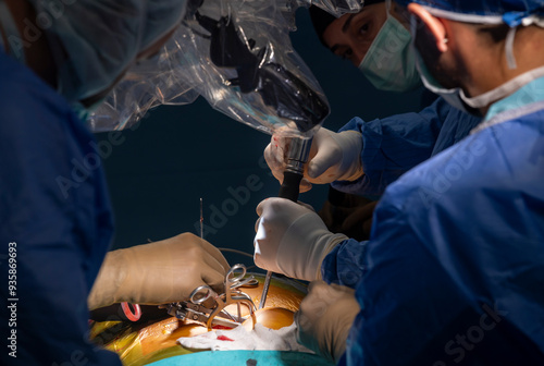 Surgeons who perform spinal cord surgery. Close up surgery team operating in modern hospital photo