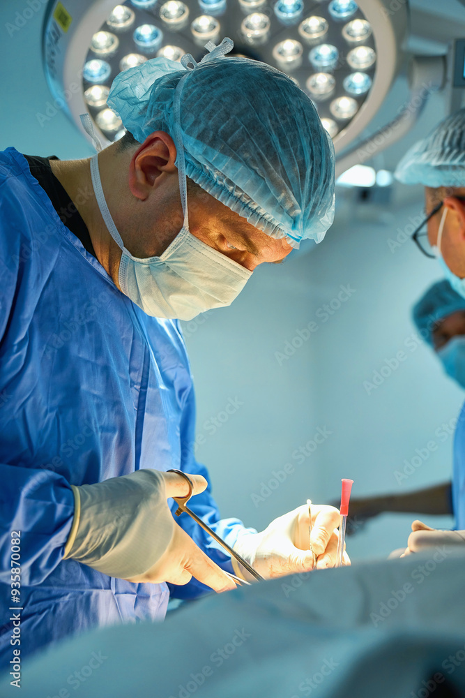 The surgeon operates on the patient under anesthesia The surgeon operates on the patient under anesthesia