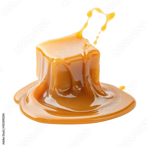 Delicious golden caramel cube melting isolated on a white background. photo