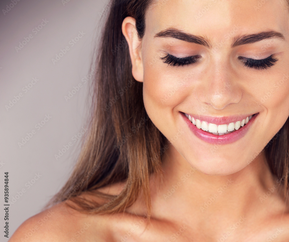 Obraz premium Woman, smile and beauty with eyes closed in studio with dermatology, wellness and makeup by background. Girl, model and person with cosmetic glow, skincare and happy for results with transformation