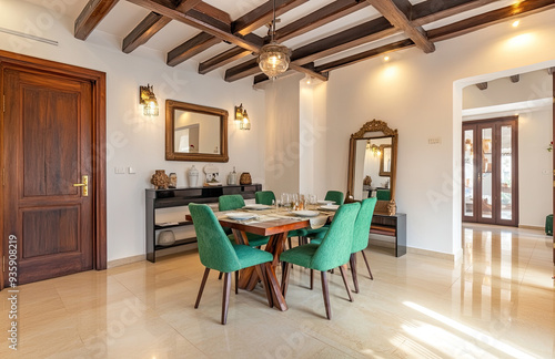 Modern dining room with a wooden table and green chairs, white walls, and beige tiles on the floor in an old Spanish villa with dark wood beams. Created with AI