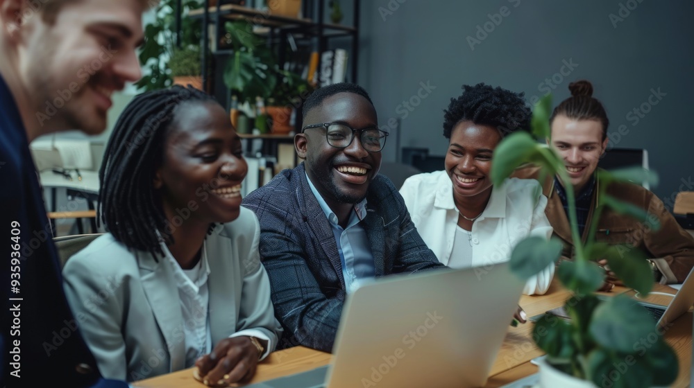 A group of diverse colleagues gather around a laptop, sharing laughter and ideas in a collaborative, joyful work environment. A group of diverse colleagues gather around a laptop, sharing laughter and ideas in a collaborative, joyful work environment.