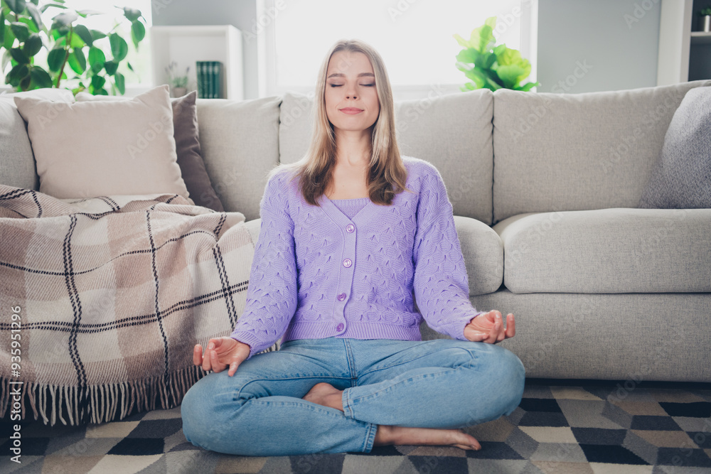 Full body photo of nice young girl sit floor meditate wear violet clothes modern cozy interior flat indoors Full body photo of nice young girl sit floor meditate wear violet clothes modern cozy interior flat indoors
