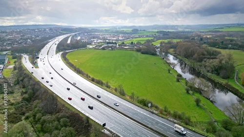 Aerial drone cinematic video footage of the M1 Motorway near the city of Wakefield, West Yorkshire, UK