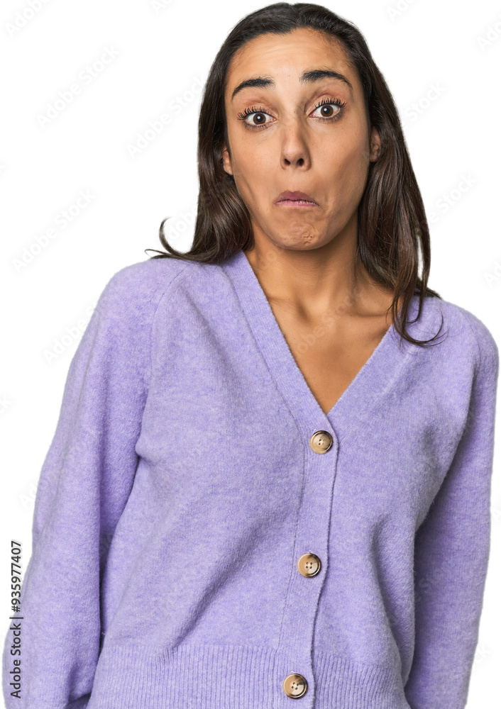 Hispanic young woman shrugs shoulders and open eyes confused. Hispanic young woman shrugs shoulders and open eyes confused.