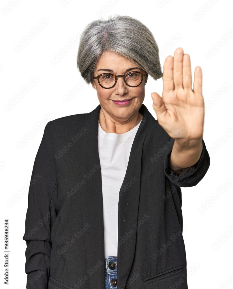 Caucasian mid-age female in business suit standing with outstretched hand showing stop sign, preventing you. Caucasian mid-age female in business suit standing with outstretched hand showing stop sign, preventing you.