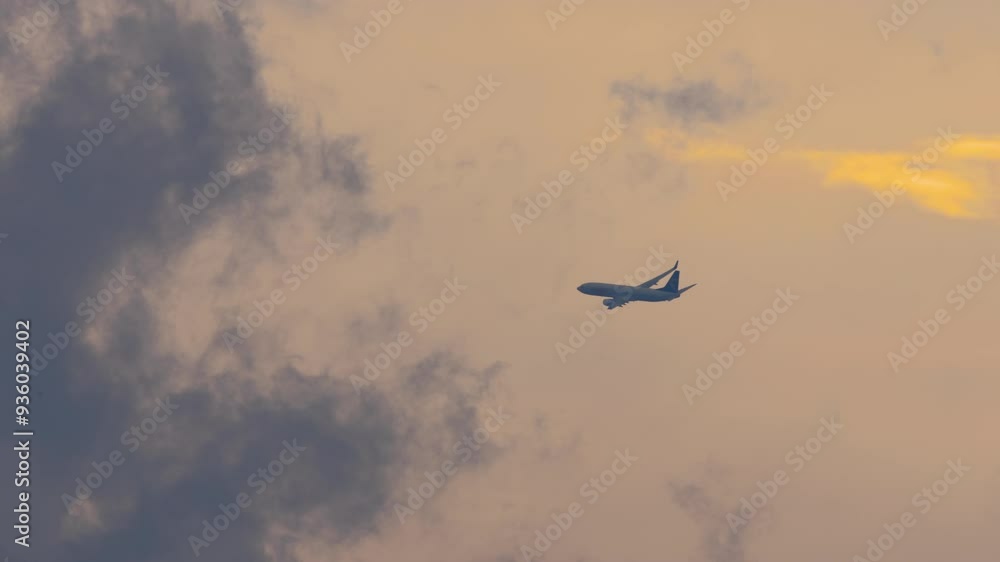 Long shot of jet plane flying in cloudy sky. Footage of the airliner taking off Long shot of jet plane flying in cloudy sky. Footage of the airliner taking off