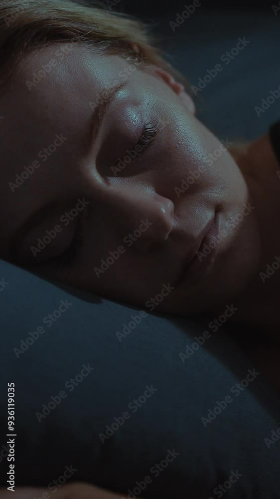 Woman sleeping peacefully in a dimly lit bedroom at night Woman sleeping peacefully in a dimly lit bedroom at night