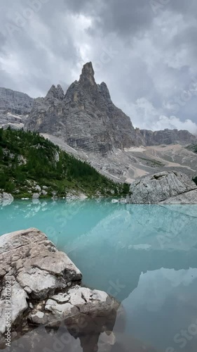 Lake Sorapis, Sapphire blue lake water, sharp rocky summit in the background, Italy, DolomitesItaly, Dolomites photo