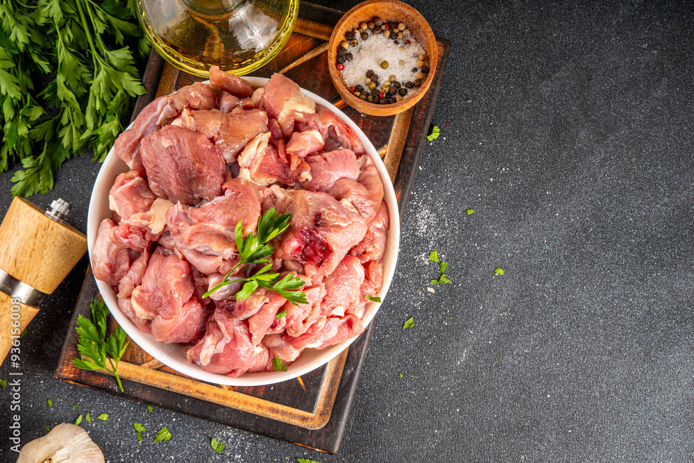 Veal, beef red meat raw chopped goulash, with herbs, condiment, olive oil and spices, cooking dinner background copy space Veal, beef red meat raw chopped goulash, with herbs, condiment, olive oil and spices, cooking dinner background copy space