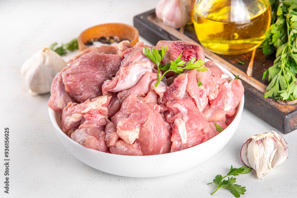 Veal, beef red meat raw chopped goulash, with herbs, condiment, olive oil and spices, cooking dinner background copy space Veal, beef red meat raw chopped goulash, with herbs, condiment, olive oil and spices, cooking dinner background copy space