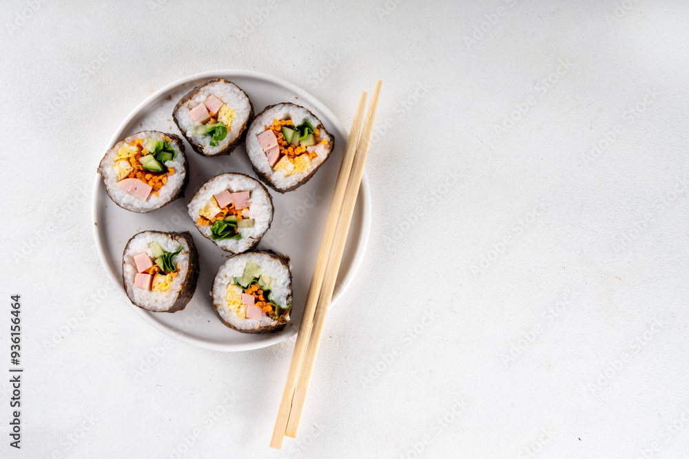 Gimbap or kimbap, korean rolls, traditional dish. Homemade kimbap roll with ham, vegetables and lettuce Gimbap or kimbap, korean rolls, traditional dish. Homemade kimbap roll with ham, vegetables and lettuce