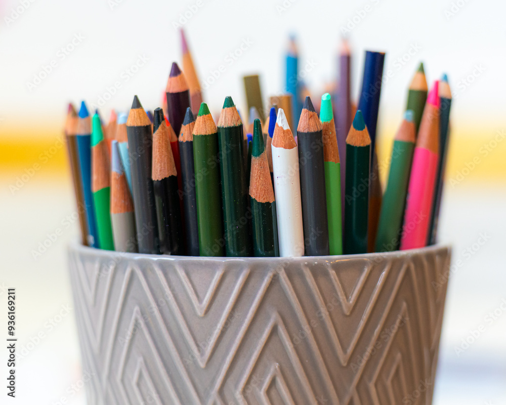 close up of a bunch of colored pencils in a holder close up of a bunch of colored pencils in a holder