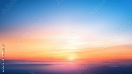 A stunning sunrise over the ocean, blending vibrant colors of orange, pink, and blue in a serene horizon.