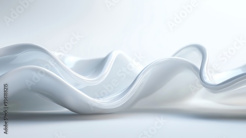 A smooth, flowing texture of white fabric creating soft waves against a light background, ideal for backgrounds or abstract designs.
