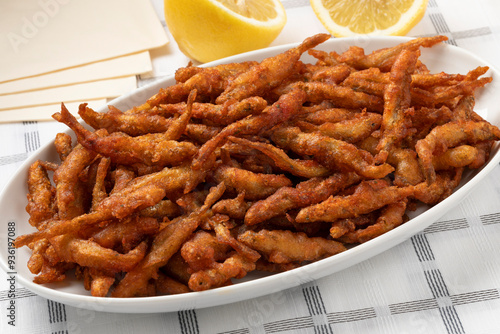 Foto Plate with deep fried smelt fish close up