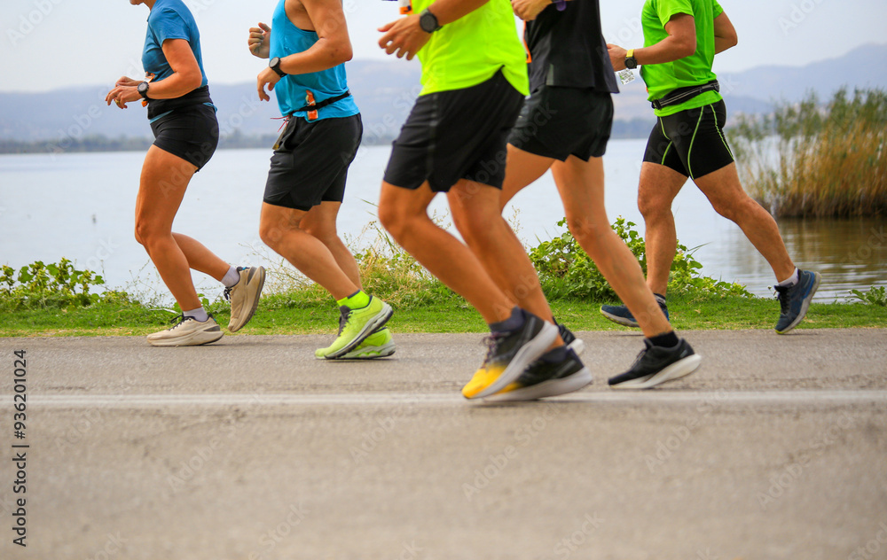 feet of runners in contest running by the lake of ioannina greece in autumn feet of runners in contest running by the lake of ioannina greece in autumn
