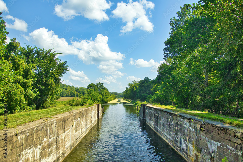 Sunny Summer day landscape of a recreational trail beside the remains of a lock on the Hennepin Canal in Northern Illinois Sunny Summer day landscape of a recreational trail beside the remains of a lock on the Hennepin Canal in Northern Illinois