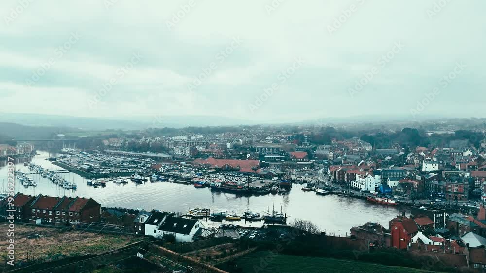 Whitby Harbor. Winter scene. Scenic misty, winters view of Whitby city and abbey in North Yorkshire, UK Whitby Harbor. Winter scene. Scenic misty, winters view of Whitby city and abbey in North Yorkshire, UK
