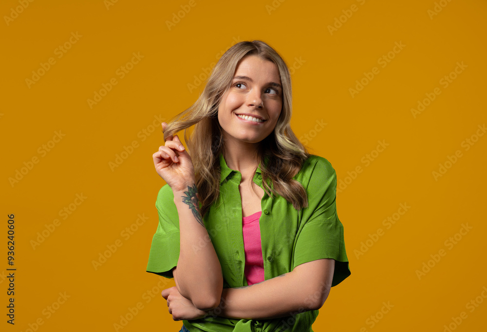 Playful charming woman smiling, flirting on yellow background.Lady wants to meet Playful charming woman smiling, flirting on yellow background.Lady wants to meet