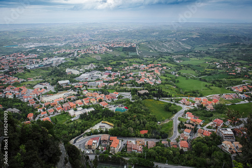 Panoramic view of the lush landscape and charming towns of San Marino under an overcast sky