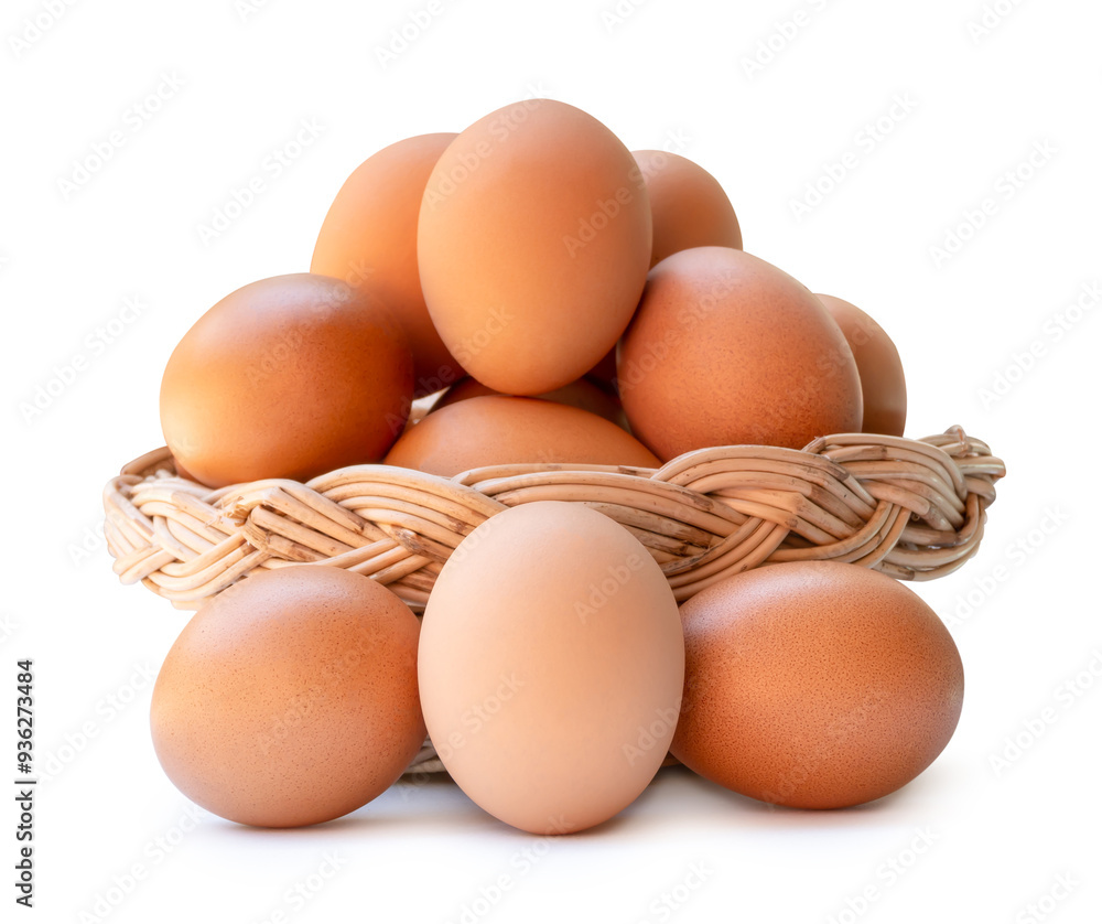 Fresh brown chicken eggs in stack in wicker basket isolated on white background with clipping path Fresh brown chicken eggs in stack in wicker basket isolated on white background with clipping path