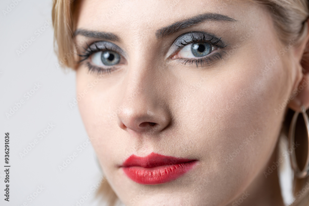 Portrait of a seductive, stylish business lady in the studio. Blonde girl in a suit and top. Portrait of a seductive, stylish business lady in the studio. Blonde girl in a suit and top.