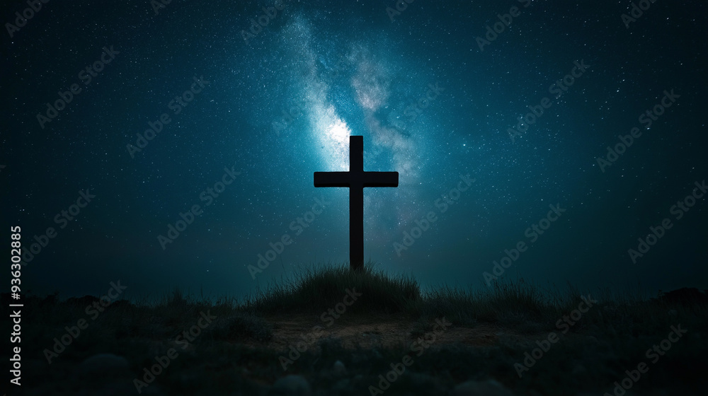 A cross is standing in a field of grass under a starry sky A cross is standing in a field of grass under a starry sky