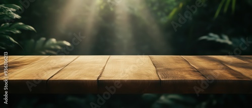 A serene wooden table against a lush, green backdrop with soft rays of sunlight filtering through the leaves.